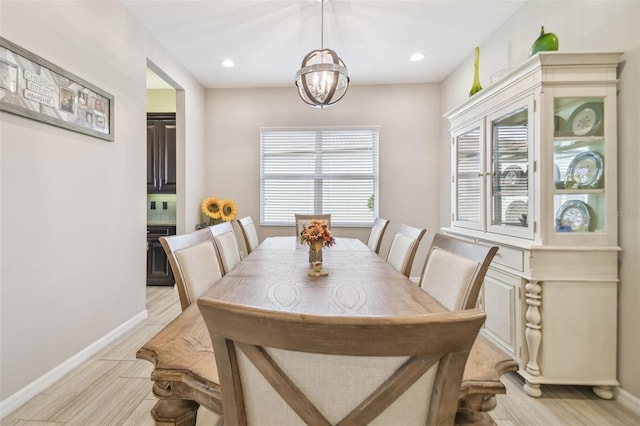 dining space with a notable chandelier