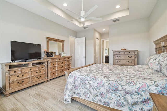 bedroom featuring ceiling fan, light hardwood / wood-style floors, and a closet