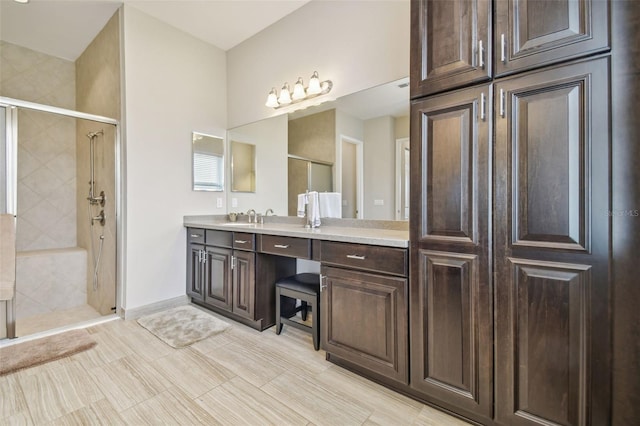 bathroom featuring vanity and walk in shower