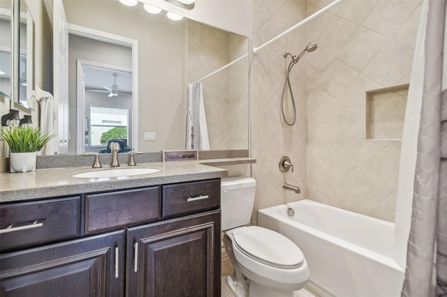 full bathroom featuring ceiling fan, toilet, shower / bathtub combination with curtain, and vanity