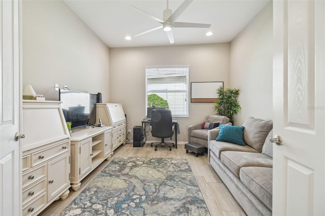 office area with ceiling fan and light hardwood / wood-style flooring