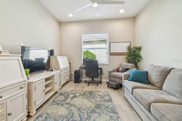 office featuring ceiling fan and light wood-type flooring