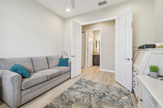 living room with light hardwood / wood-style flooring