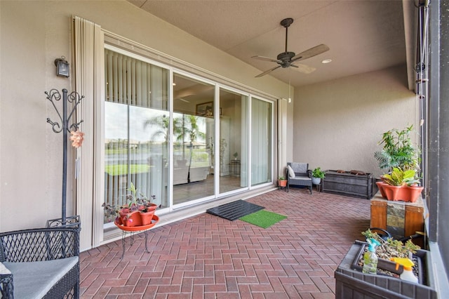 view of patio / terrace featuring ceiling fan