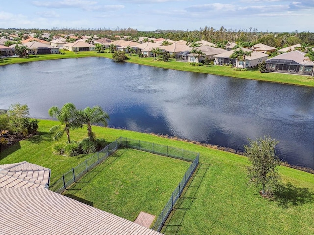 birds eye view of property with a water view