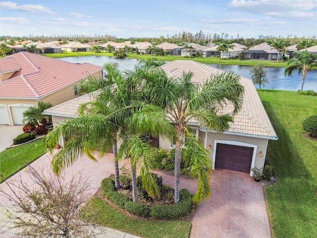 birds eye view of property with a water view