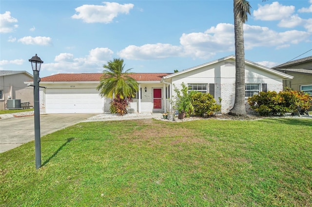 single story home with central AC, a garage, and a front lawn