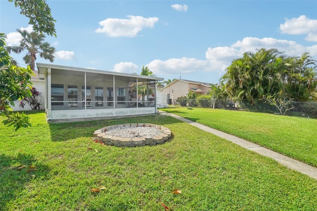 view of yard featuring a sunroom