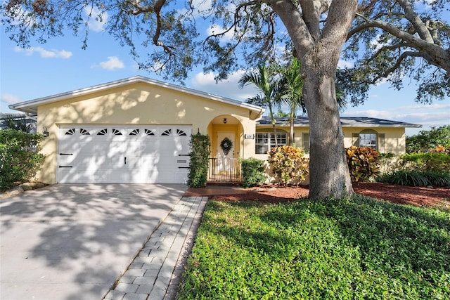 ranch-style home featuring a garage