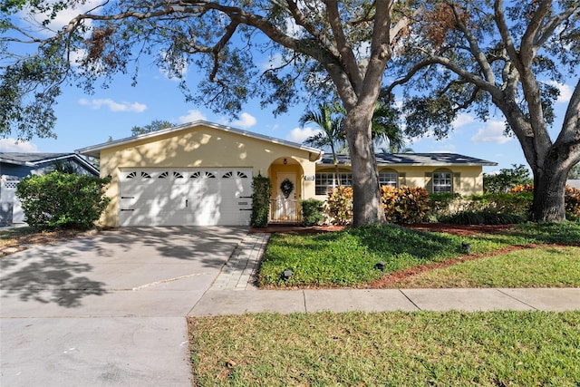 single story home featuring a front yard and a garage