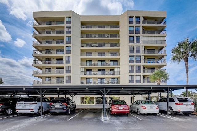1651 Sand Key Estates Ct Unit 52, Clearwater, FL 33767 - view of apartment building / complex featuring covered parking