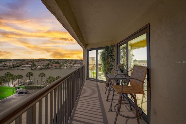 balcony at dusk with a water view