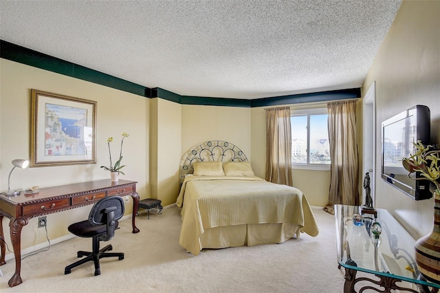 carpeted bedroom featuring a textured ceiling