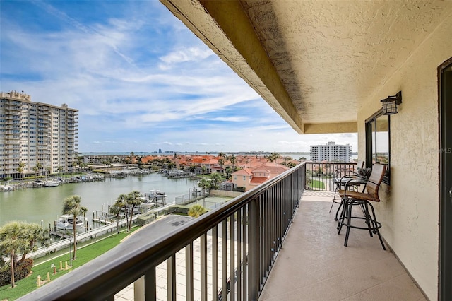 balcony featuring a water view