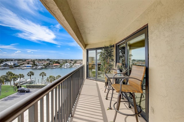 balcony featuring a water view