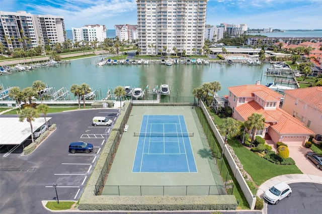 birds eye view of property with a water view