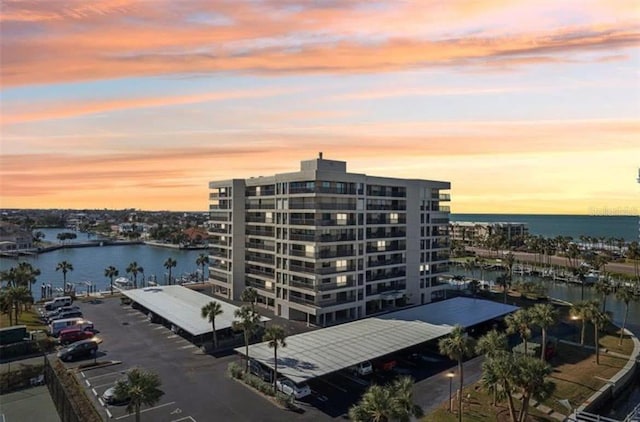 1651 Sand Key Estates Ct Unit 52, Clearwater, FL 33767 - property at dusk featuring a water view