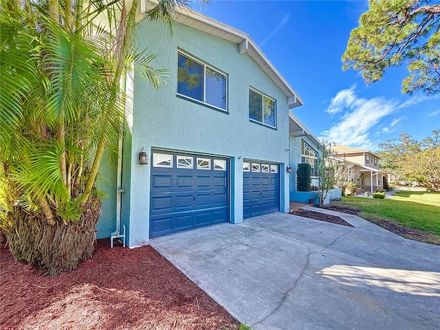 view of side of home with a garage