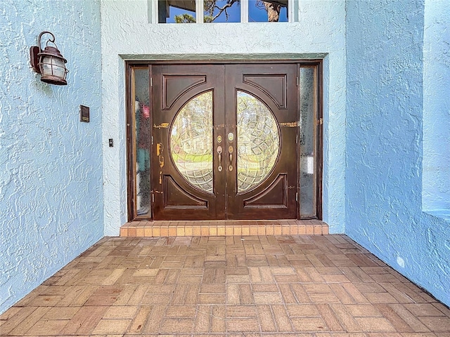 property entrance featuring french doors