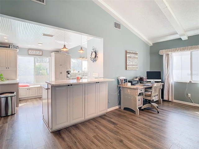 home office featuring lofted ceiling with beams and dark hardwood / wood-style floors