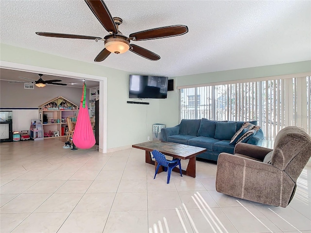 living room with light tile patterned floors and a textured ceiling