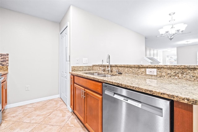 kitchen featuring a notable chandelier, light tile patterned floors, light stone countertops, sink, and dishwasher