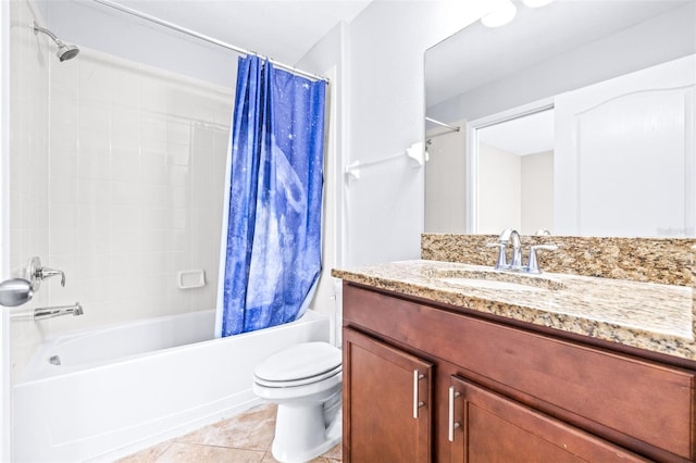 full bathroom with vanity, tile patterned flooring, toilet, and shower / tub combo