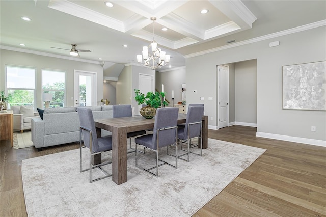 dining area featuring coffered ceiling, hardwood / wood-style flooring, and crown molding