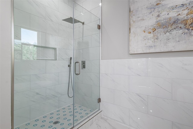 3845 Seena Manor Ct, Tampa, FL 33618 - bathroom featuring a shower stall and marble look tile flooring