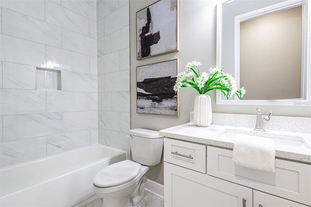 full bathroom featuring toilet, tiled shower / bath combo, and vanity