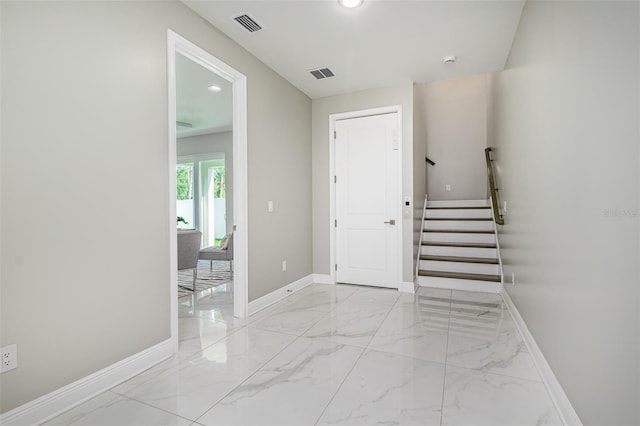 3845 Seena Manor Ct, Tampa, FL 33618 - hall featuring baseboards, light marble finish flooring, stairway, and recessed lighting
