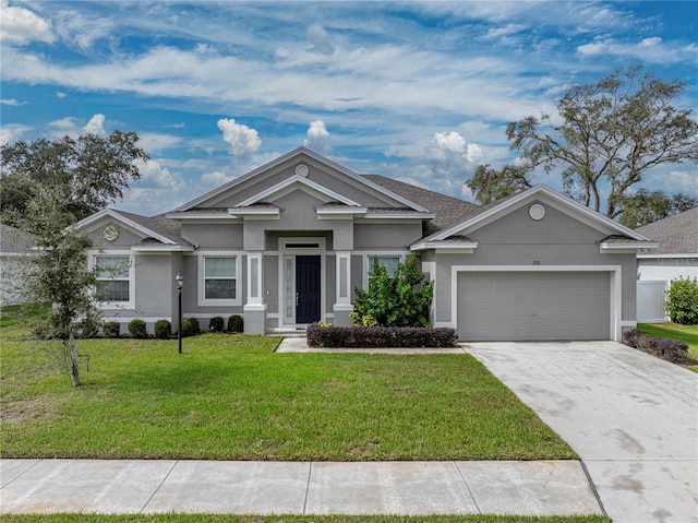 view of front of property with a front lawn and a garage