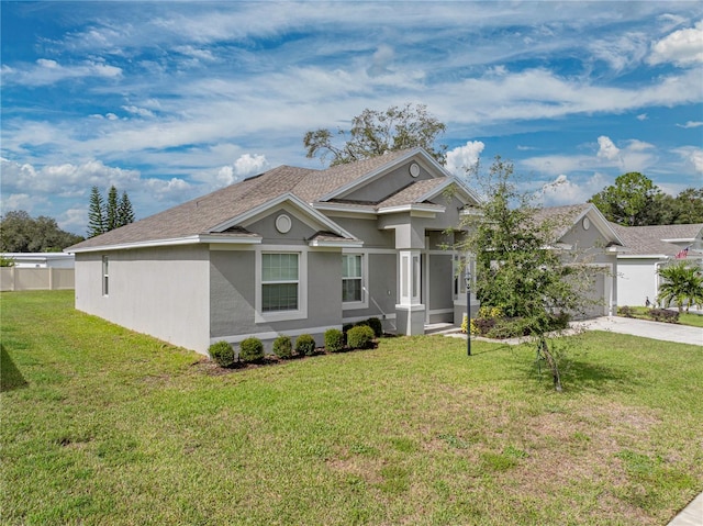 view of front of home featuring a front yard and a garage