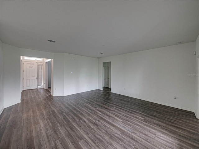 232 Samantha Ave, Auburndale, FL 33823 - spare room featuring dark wood-style flooring and baseboards