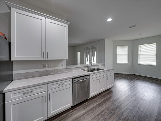 232 Samantha Ave, Auburndale, FL 33823 - kitchen featuring dishwasher, a sink, baseboards, white cabinetry, and recessed lighting