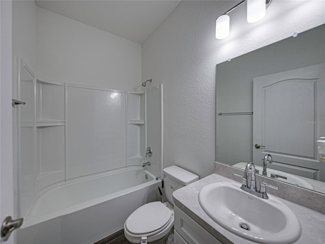 232 Samantha Ave, Auburndale, FL 33823 - full bath with toilet, vanity, a textured wall, and bathing tub / shower combination