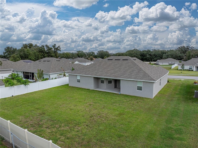 232 Samantha Ave, Auburndale, FL 33823 - rear view of property with a patio, roof with shingles, a residential view, and stucco siding