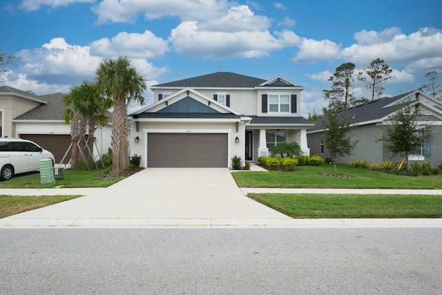 view of front of property featuring a garage and a front yard