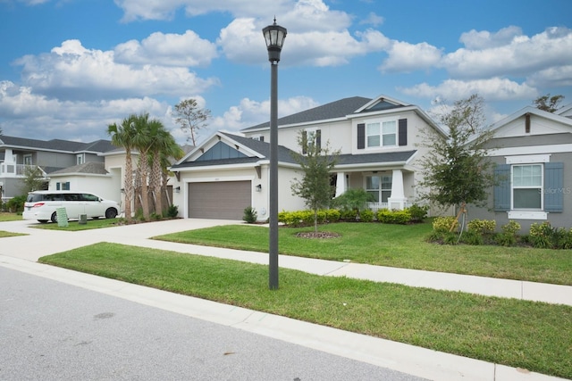 view of front of home featuring a garage and a front yard