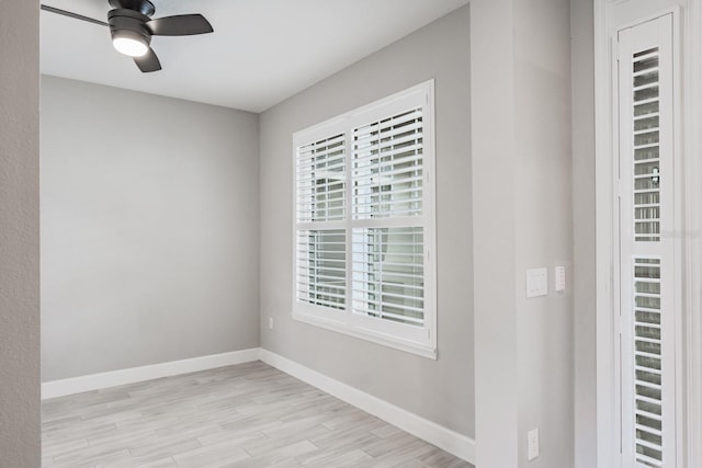 unfurnished room with ceiling fan and light hardwood / wood-style flooring