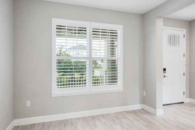 spare room with light hardwood / wood-style floors