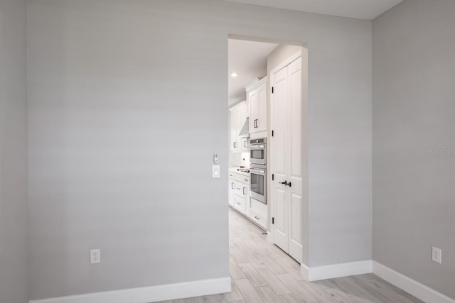 hallway featuring light wood-type flooring