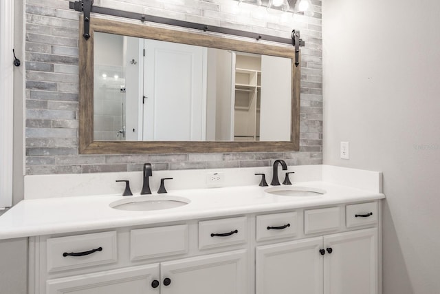 bathroom with vanity and tasteful backsplash