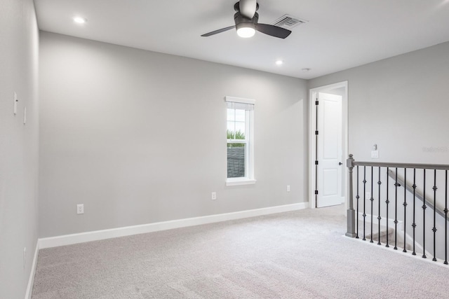 carpeted empty room with ceiling fan