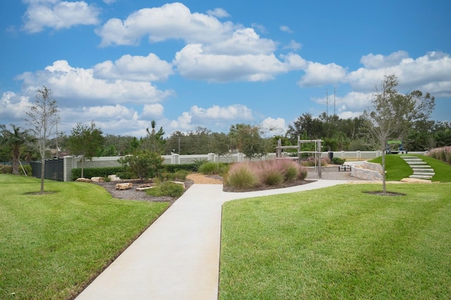 view of property's community featuring a yard