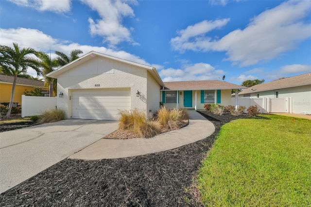 single story home featuring a front yard and a garage