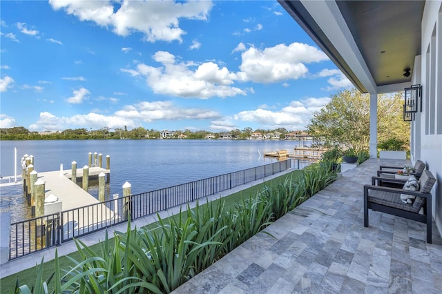 exterior space featuring a water view and a boat dock