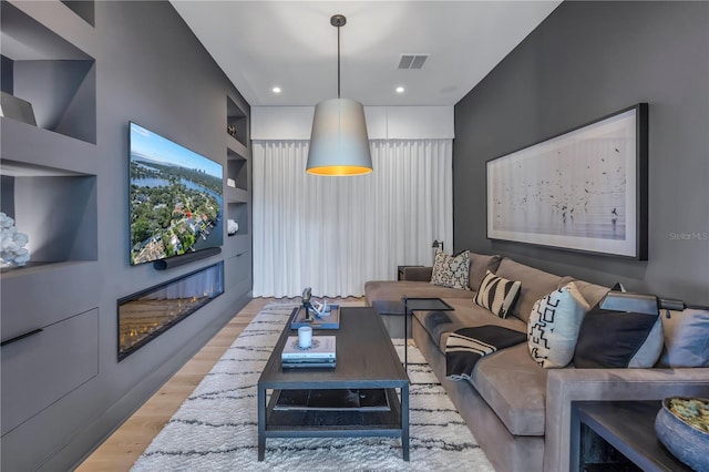 living room with light hardwood / wood-style floors