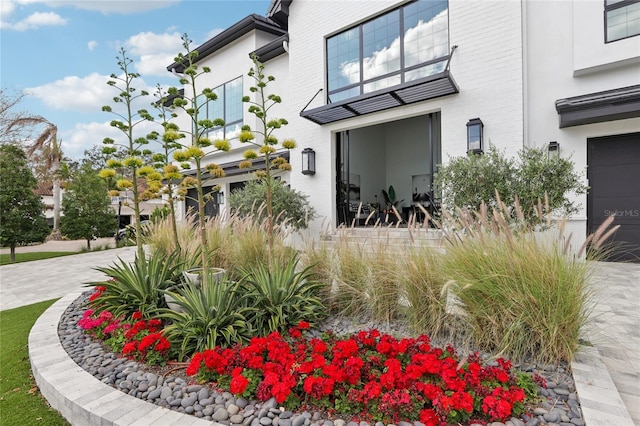 property entrance with brick siding