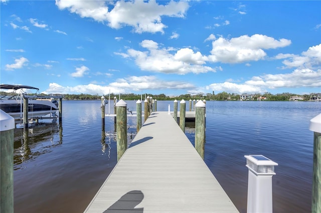 dock area featuring a water view and boat lift